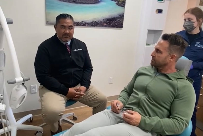 Patient and doctor going over dental procedure information within the dental office