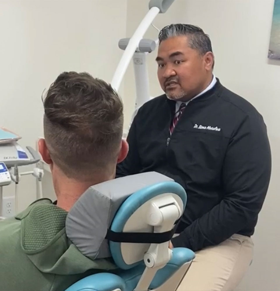 Patient and doctor going over dental procedure information within the dental office