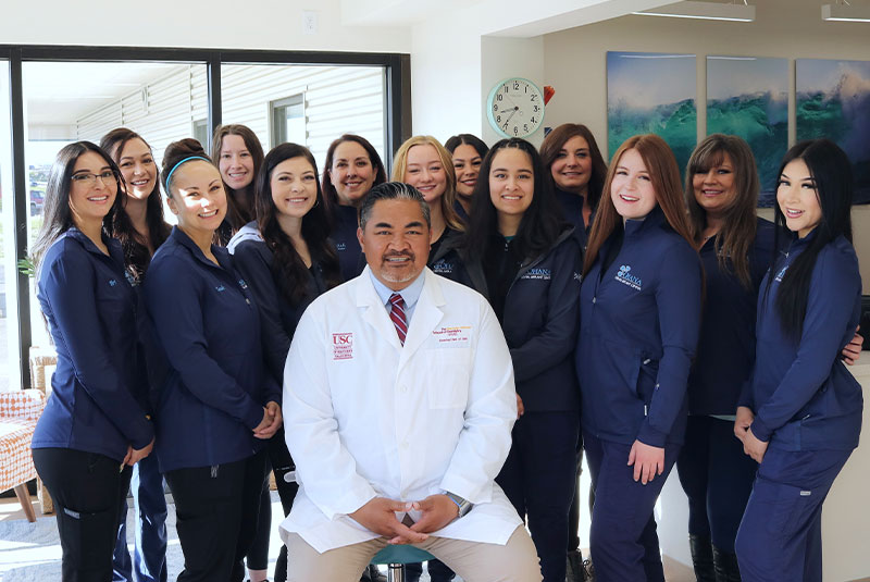 Group picture of the doctor of the practice and staff members as well