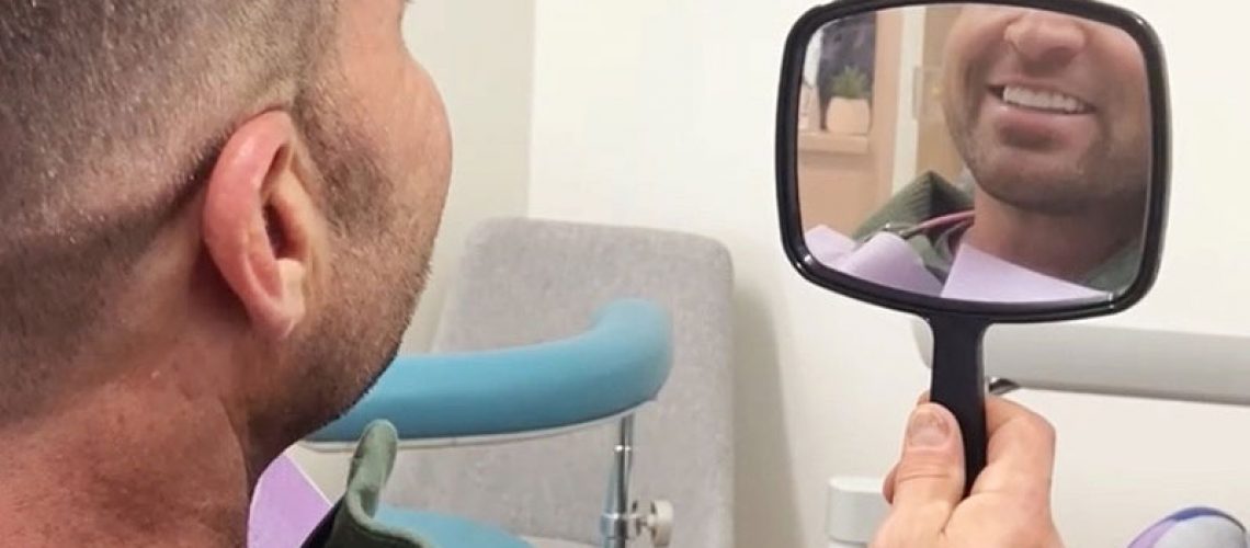 Patient smiling confidently after their dental procedure